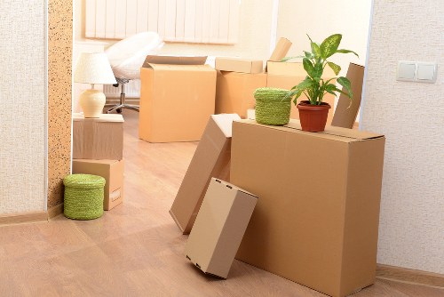 Professional movers handling furniture in Kingscross